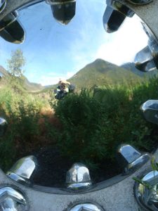 photo of my reflection taking a picture inside the hub cap of my semi truck wheel provides a great example of using frames in photography.