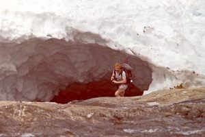 photo of a cave being used to frame the hiker as the main subject